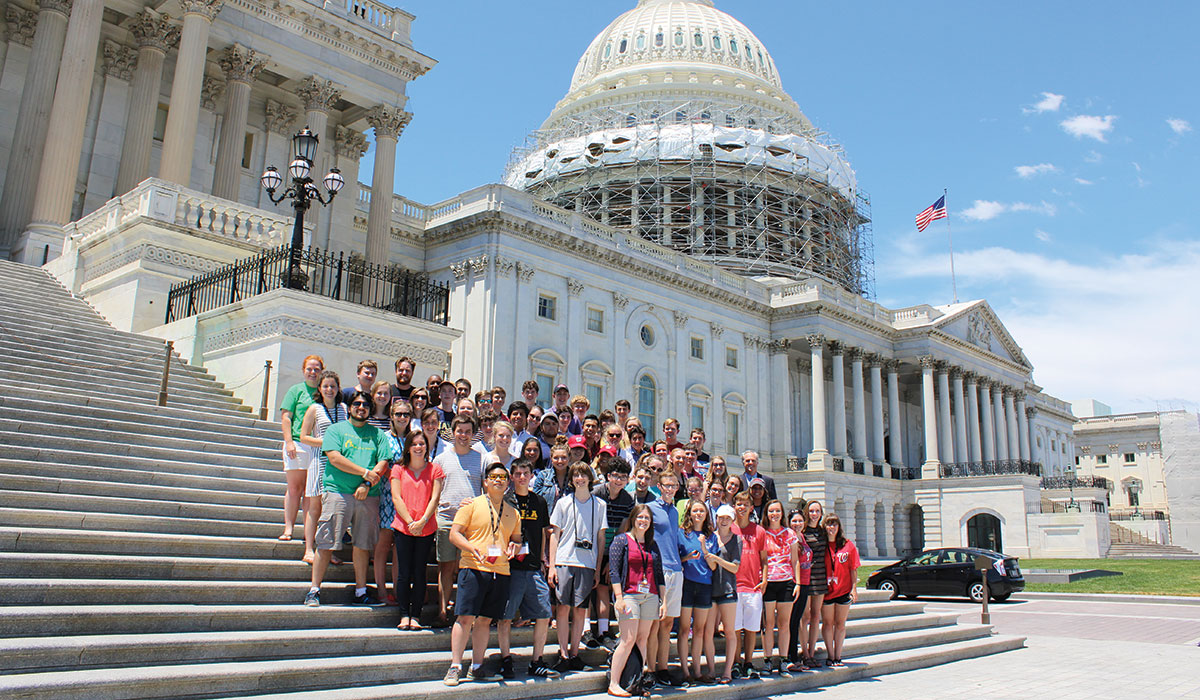 Light the World! students standing on the steps of the U.S. Capitol.