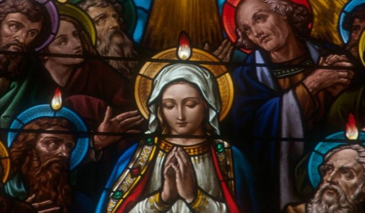 Stained glass Mary at Pentecost with disciples