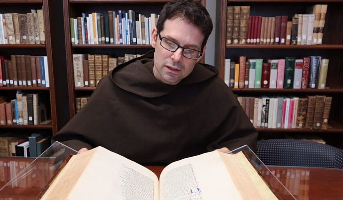 Carmelite brother studying in library